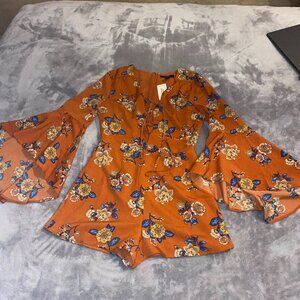 Orange Romper with Floral Design